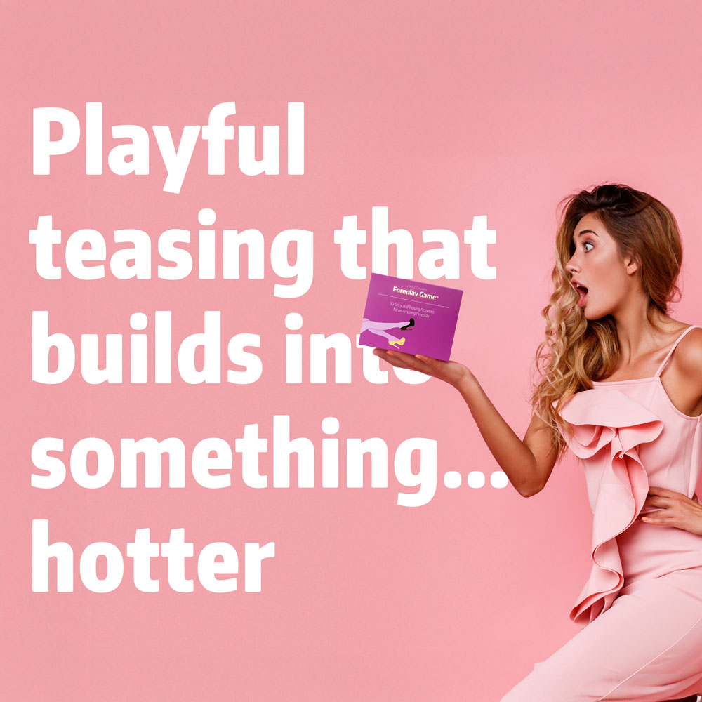 woman holding the Foreplay Game by Joyful couple in her hands, she is excited, pink background, pink dress, modern image, square format 1:1