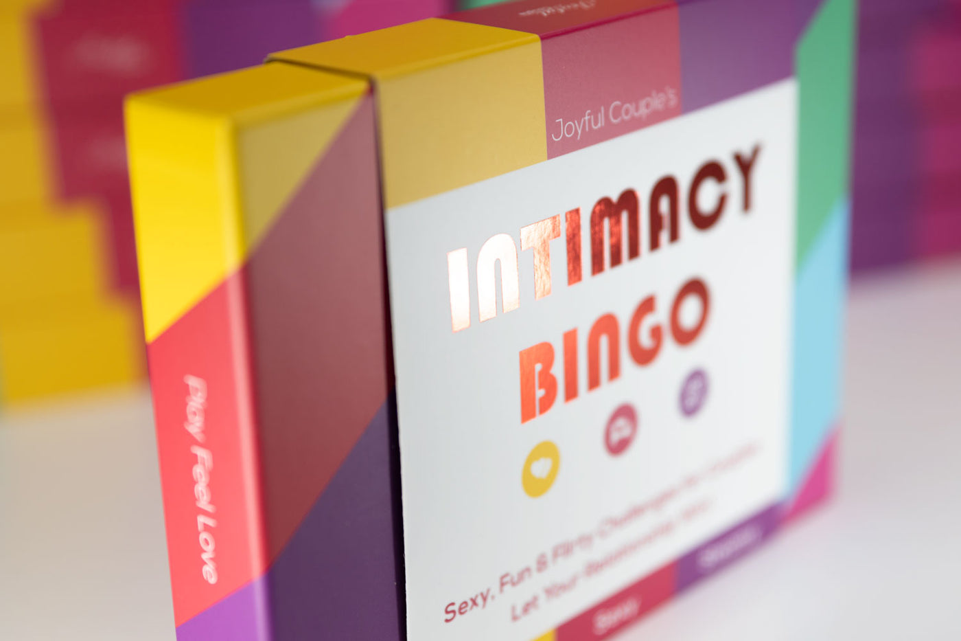 Joyful Couple's Intimacy Bingo, intimate sex card game for couples, close up of the box name and design