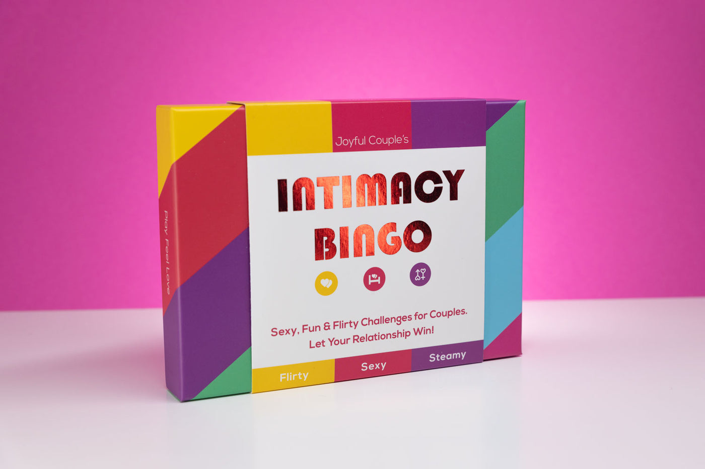 Joyful Couple's Intimacy Bingo, intimate sex card game for couples, box on a white and pink background