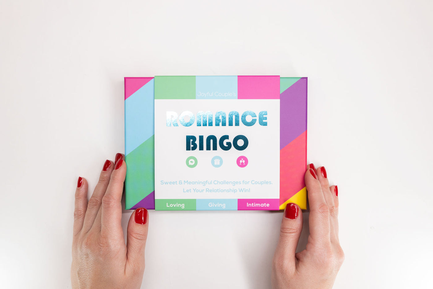 joyful couple's romance bingo, close up of a woman  holding the box, white background