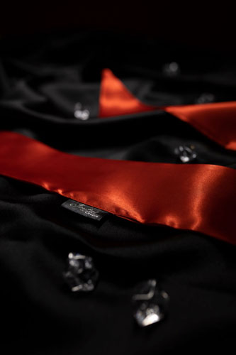 sensual pleasure ties by joyful couple, red ties ob black fabric